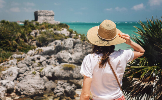 girl with hat in Tulum Ruins