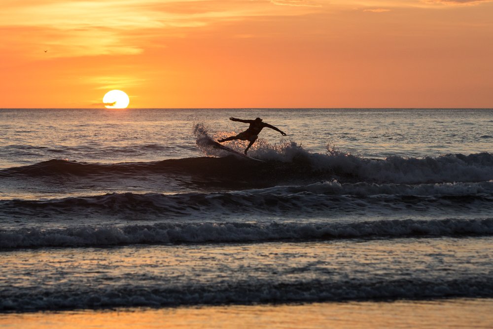 Surfer's silhouette at sunset