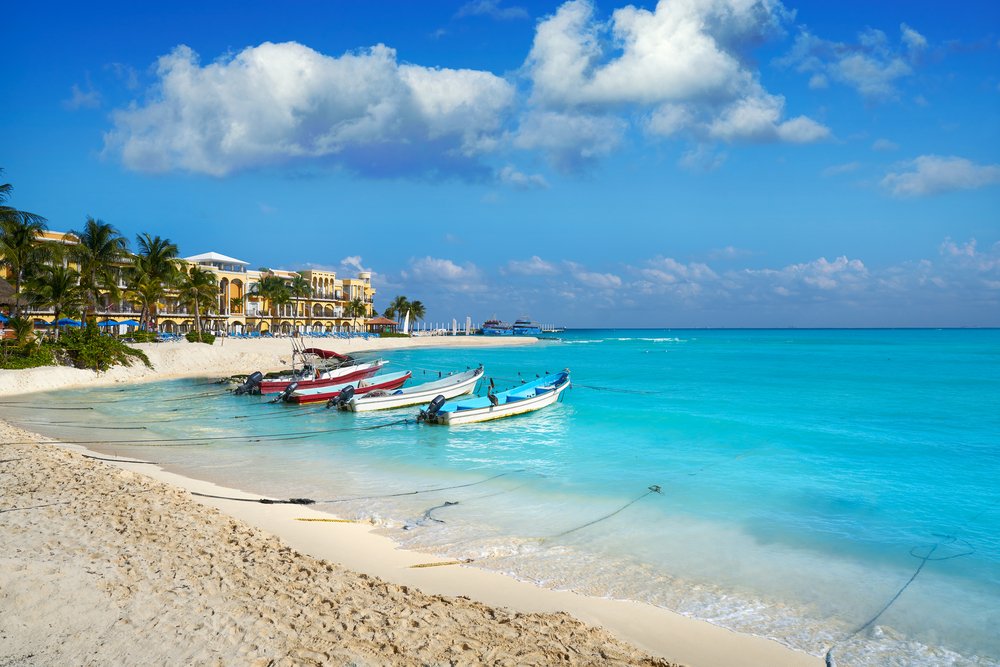 boats tied to the shore in in the beach town of Playa Del Carmen in Mexico