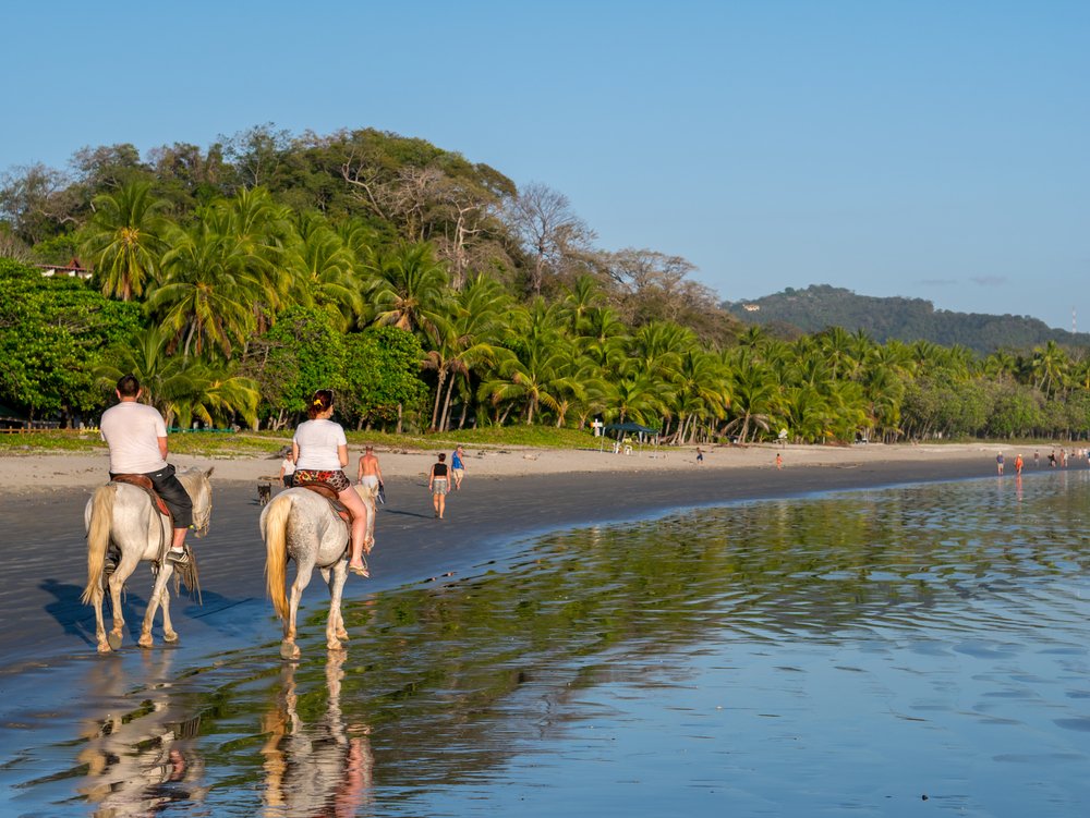 Playa Samara, Costa Rica with 2 people on horseback