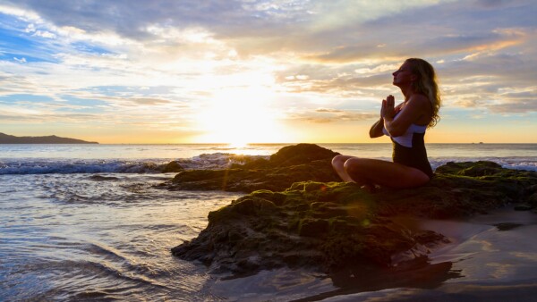 Woman doing yoga in Costa Rica feature