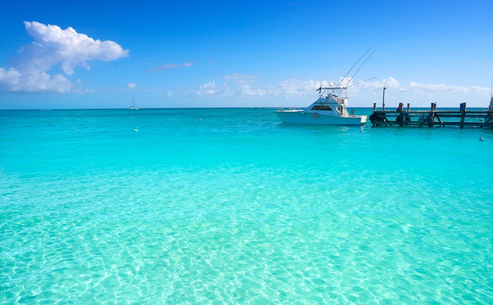 boat off pier in Punta Maroma Mexico