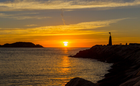 Sunset on Playa Chahue with lighthouse