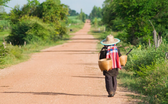 man walking in Northern Thailand countryside