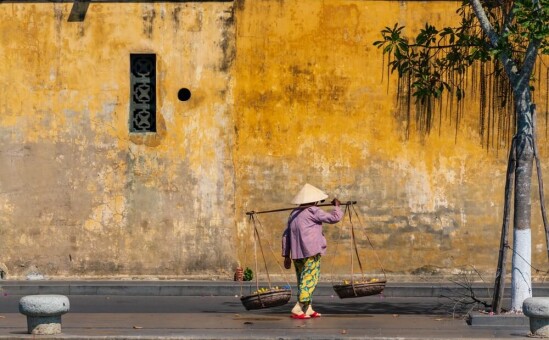 Vietnamese person walking in Hoi An